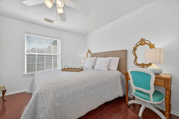 a bedroom with furniture and a window