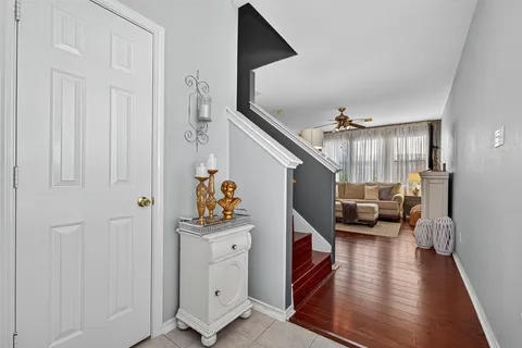 a bathroom with a granite countertop sink a mirror and a bathtub