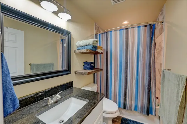 a living room with a bed furniture and a window