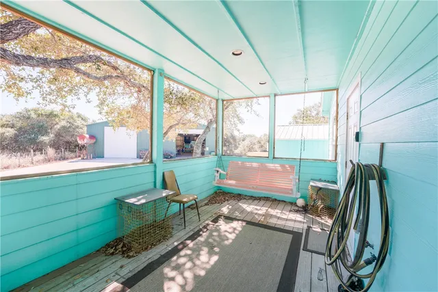 a living room filled with furniture and a rug