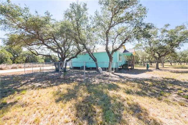 a view of house with trees in the background