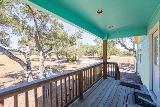 a view of balcony with wooden floor