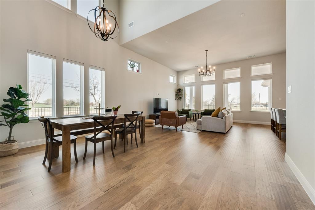8922 Edna Place Rowlett, TX 75089 - Photo 12 of 37 Dining room with an inviting chandelier, baseboards, light wood-type flooring, and visible vents