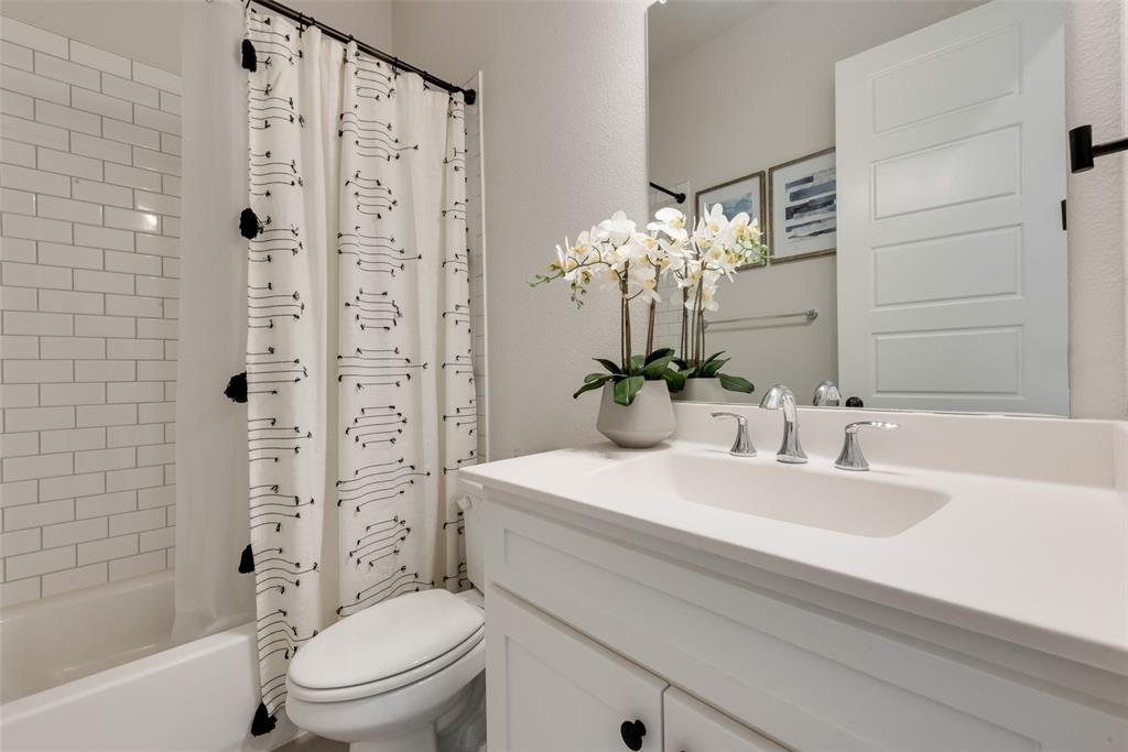 8922 Edna Place Rowlett, TX 75089 - Photo 18 of 37 Full bath with vanity, toilet, and shower / tub combo with curtain