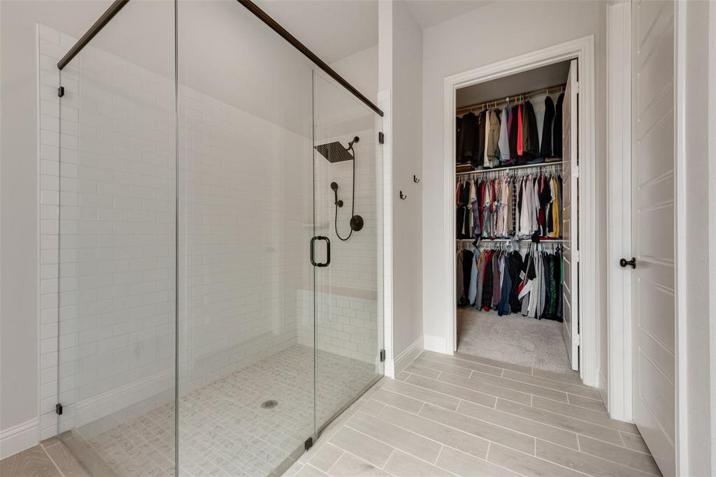 8922 Edna Place Rowlett, TX 75089 - Photo 25 of 37 Full bath featuring a walk in closet and a shower stall