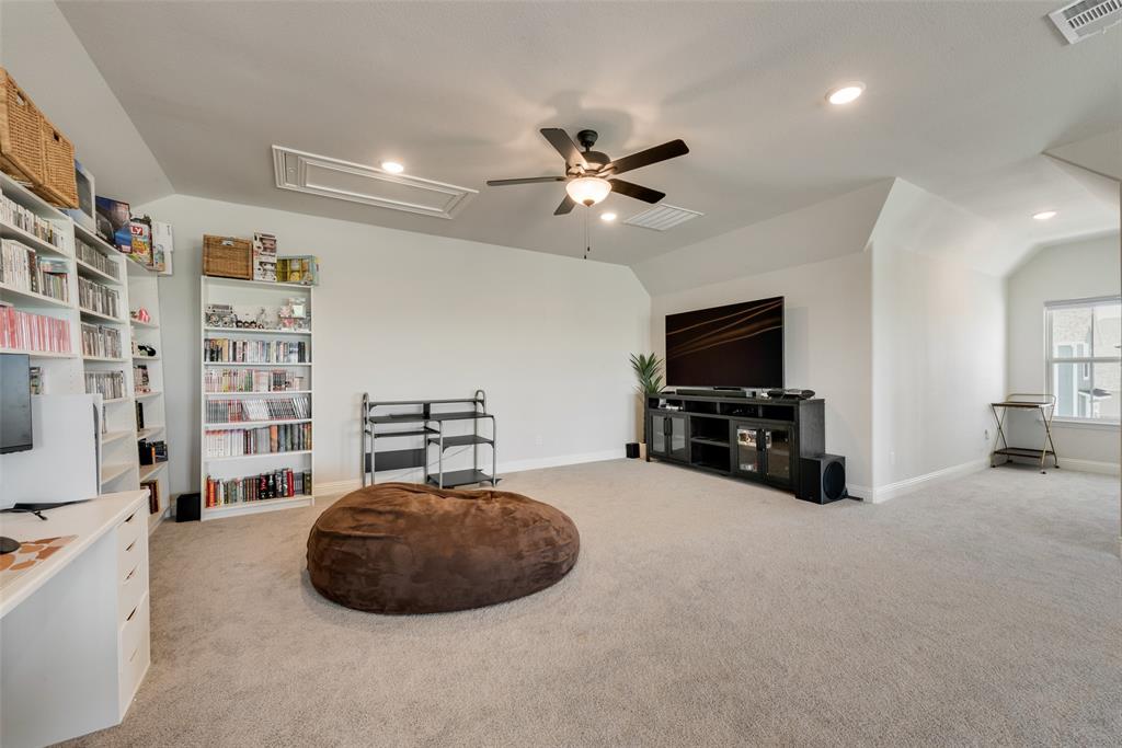 8922 Edna Place Rowlett, TX 75089 - Photo 30 of 37 Living area with visible vents, attic access, a ceiling fan, and vaulted ceiling