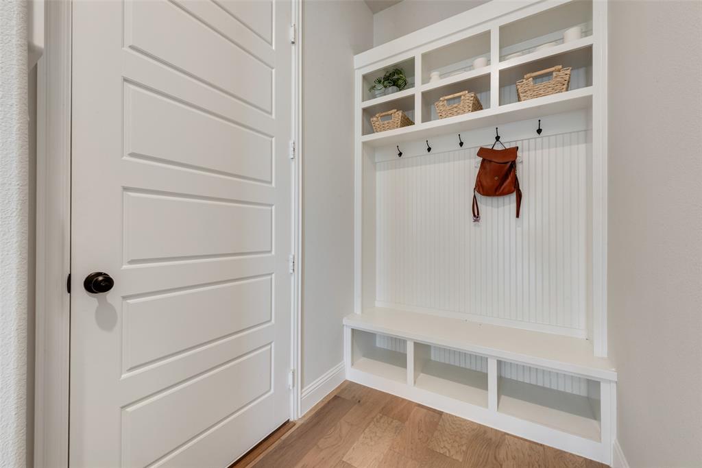 8922 Edna Place Rowlett, TX 75089 - Photo 33 of 37 Mudroom with baseboards and light wood-style floors
