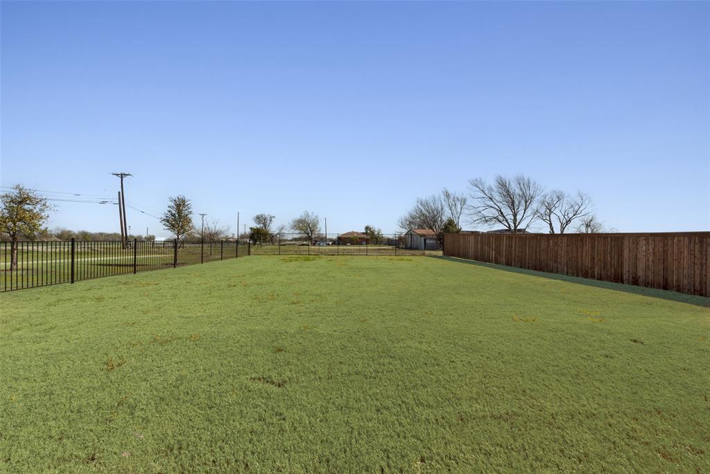 8922 Edna Place Rowlett, TX 75089 - Photo 35 of 37 View of yard with a rural view and a fenced backyard
