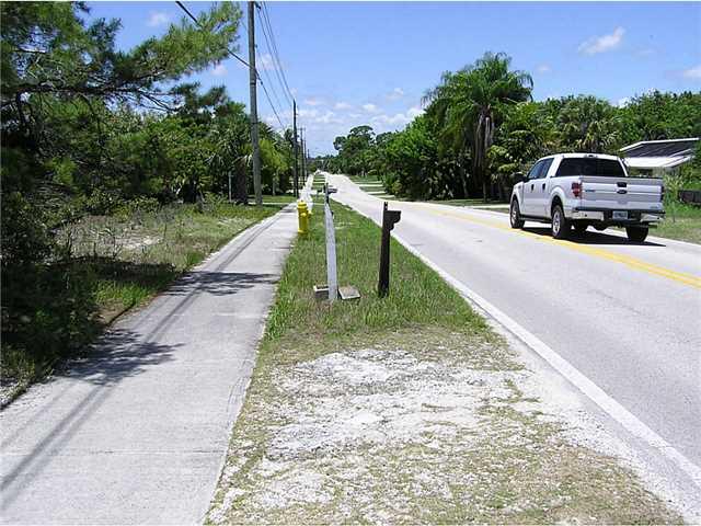 5164 Southeast Horseshoe Point Road Stuart, FL 34997 - Photo 14 of 25 a car parked on the side of the road