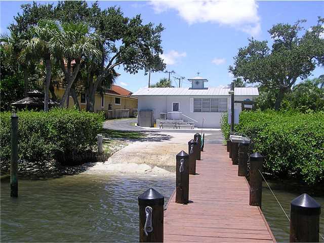 5164 Southeast Horseshoe Point Road Stuart, FL 34997 - Photo 23 of 25 a view of a house with yard and lake view