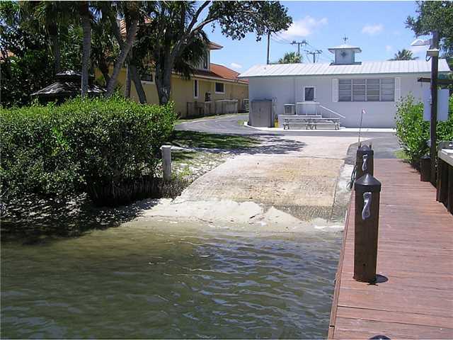 5164 Southeast Horseshoe Point Road Stuart, FL 34997 - Photo 24 of 25 a view of a house with a yard