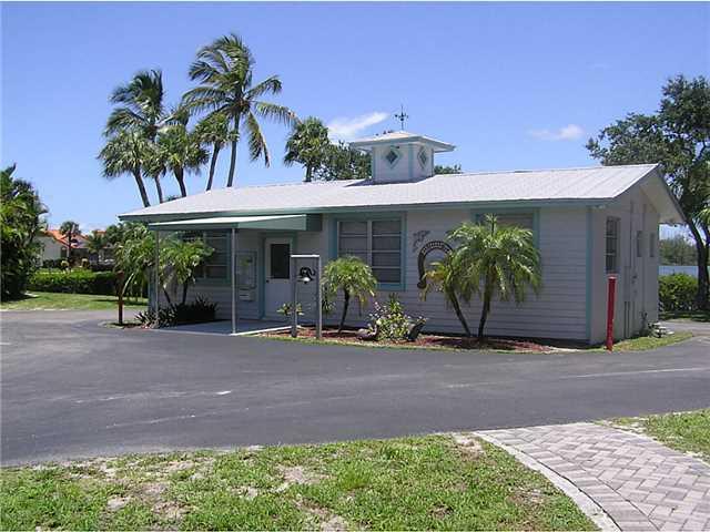 5164 Southeast Horseshoe Point Road Stuart, FL 34997 - Photo 25 of 25 a front view of a house with garden