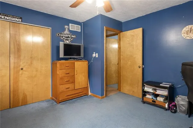 a view of room with window and furniture