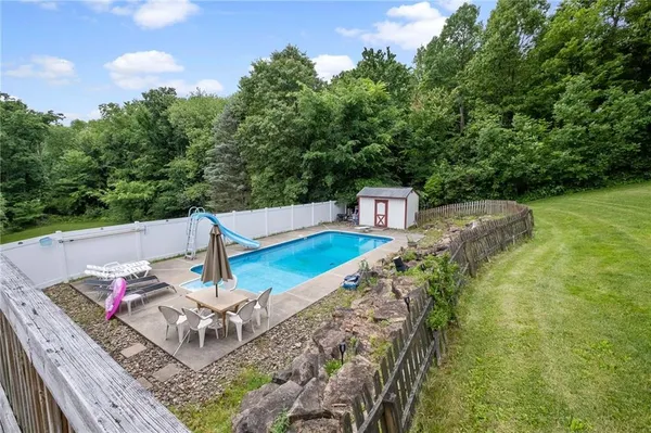 a view of a backyard with sitting area