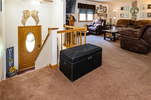 a living room with furniture and a mirror