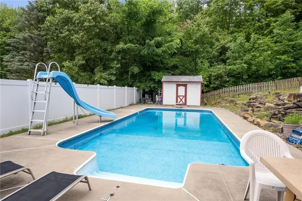 a swimming pool with a outdoor seating