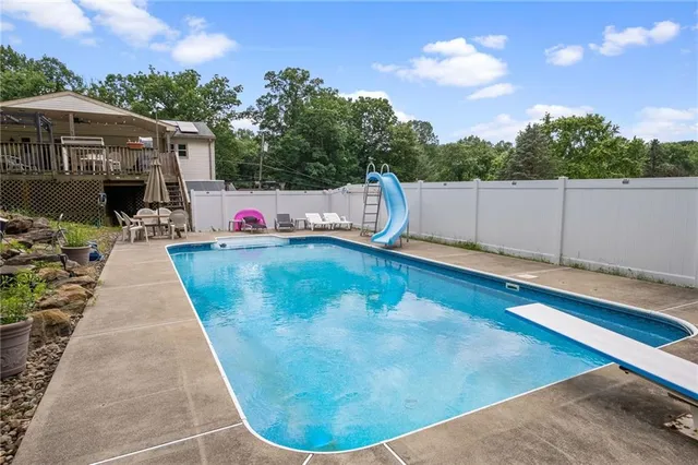 a view of a backyard with sitting area