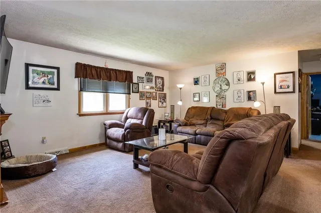 a living room with furniture a window and a couch
