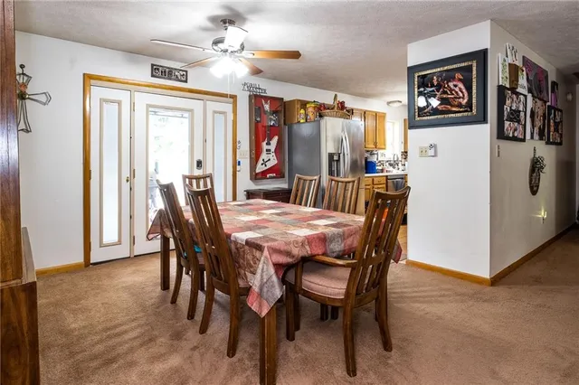 a dining room with furniture and window