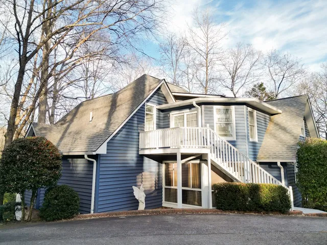 a kitchen with stainless steel appliances a sink a refrigerator a window and a counter space