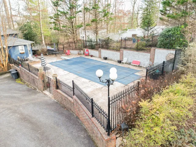 a view of a patio with a table and chairs