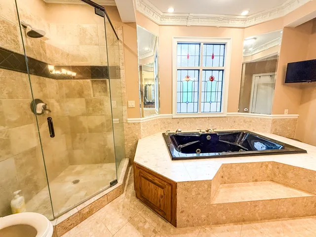 a bathroom with a granite countertop sink toilet and a mirror