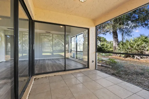 a view of entryway with a floor to ceiling window