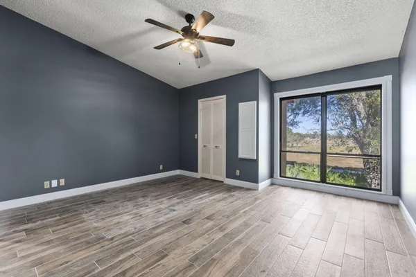 a view of an empty room with a window