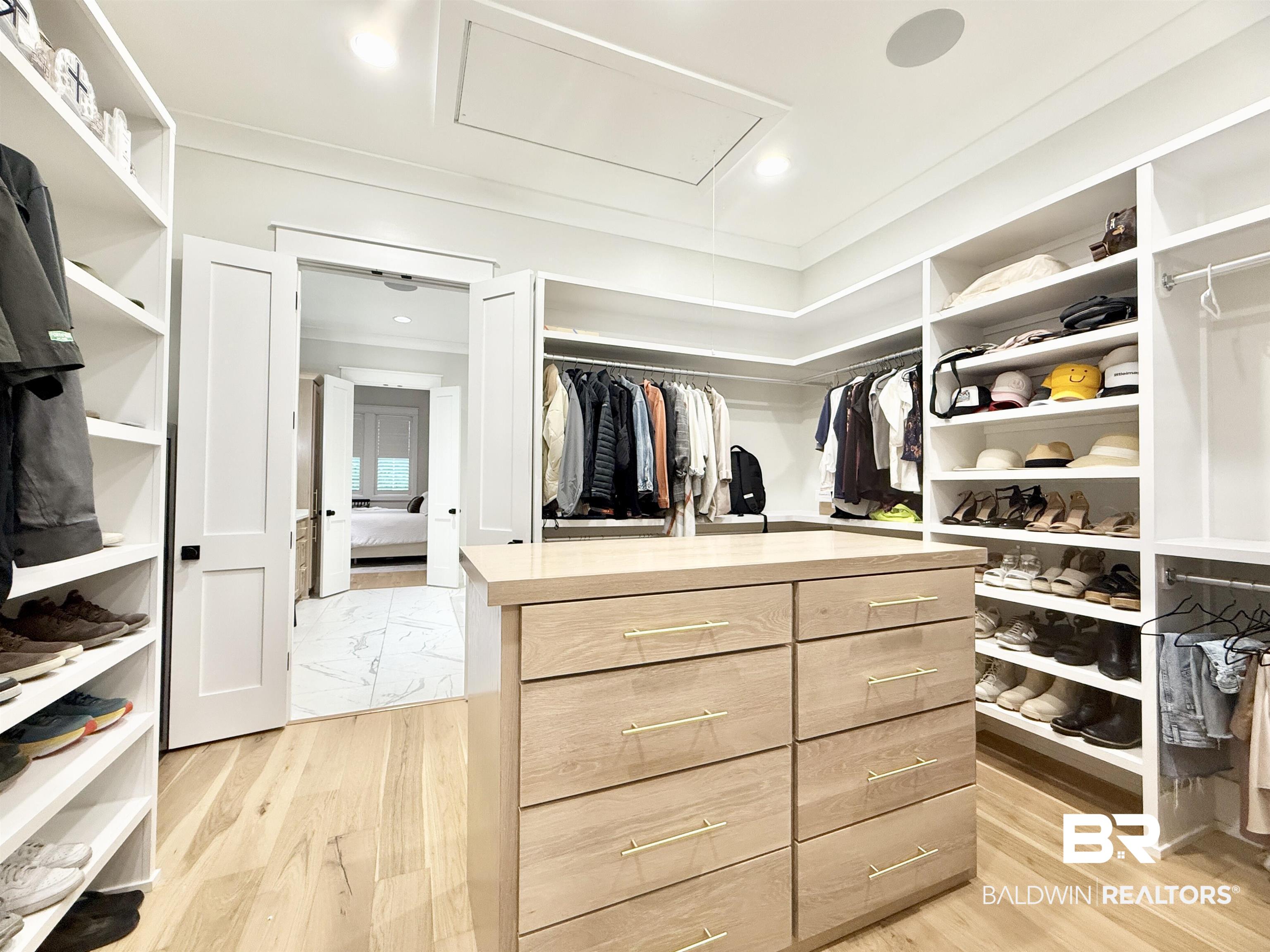 21767 Gallery Boulevard Fairhope, AL 36532 - Photo 39 of 74 Walk in closet with attic access and light wood finished floors