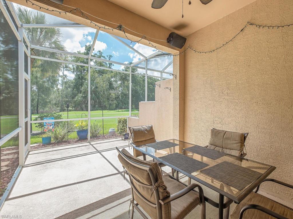 1728 Morning Sun Lane, Unit D8 Naples, FL 34119 - Photo 11 of 12 a view of a patio with a table and chairs