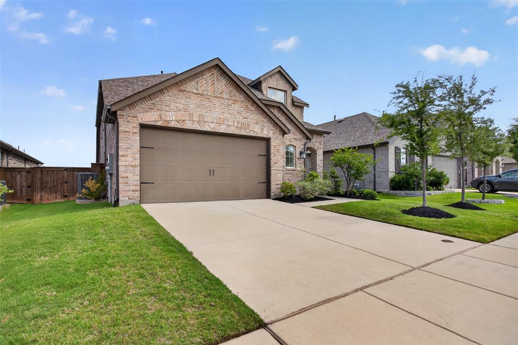 629 Claverton Lane Forney, TX 75126 - Photo 28 of 33 a front view of a house with a yard and garage