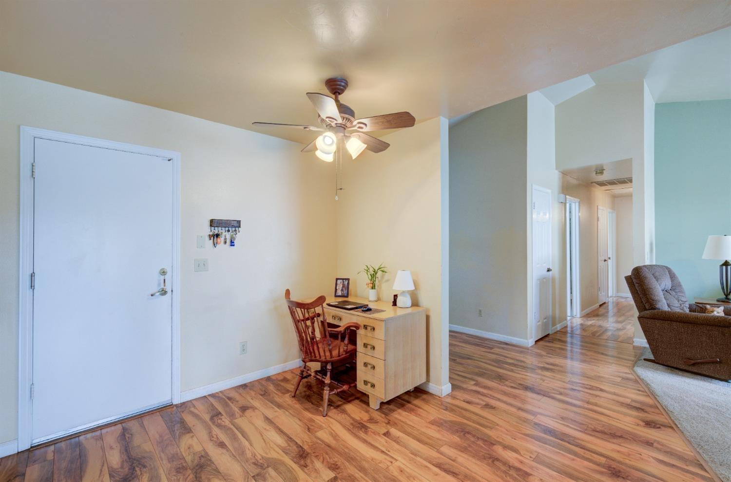 695 West Polson Avenue Clovis, CA 93612 - Photo 13 of 27 a view of a workspace with furniture and wooden floor