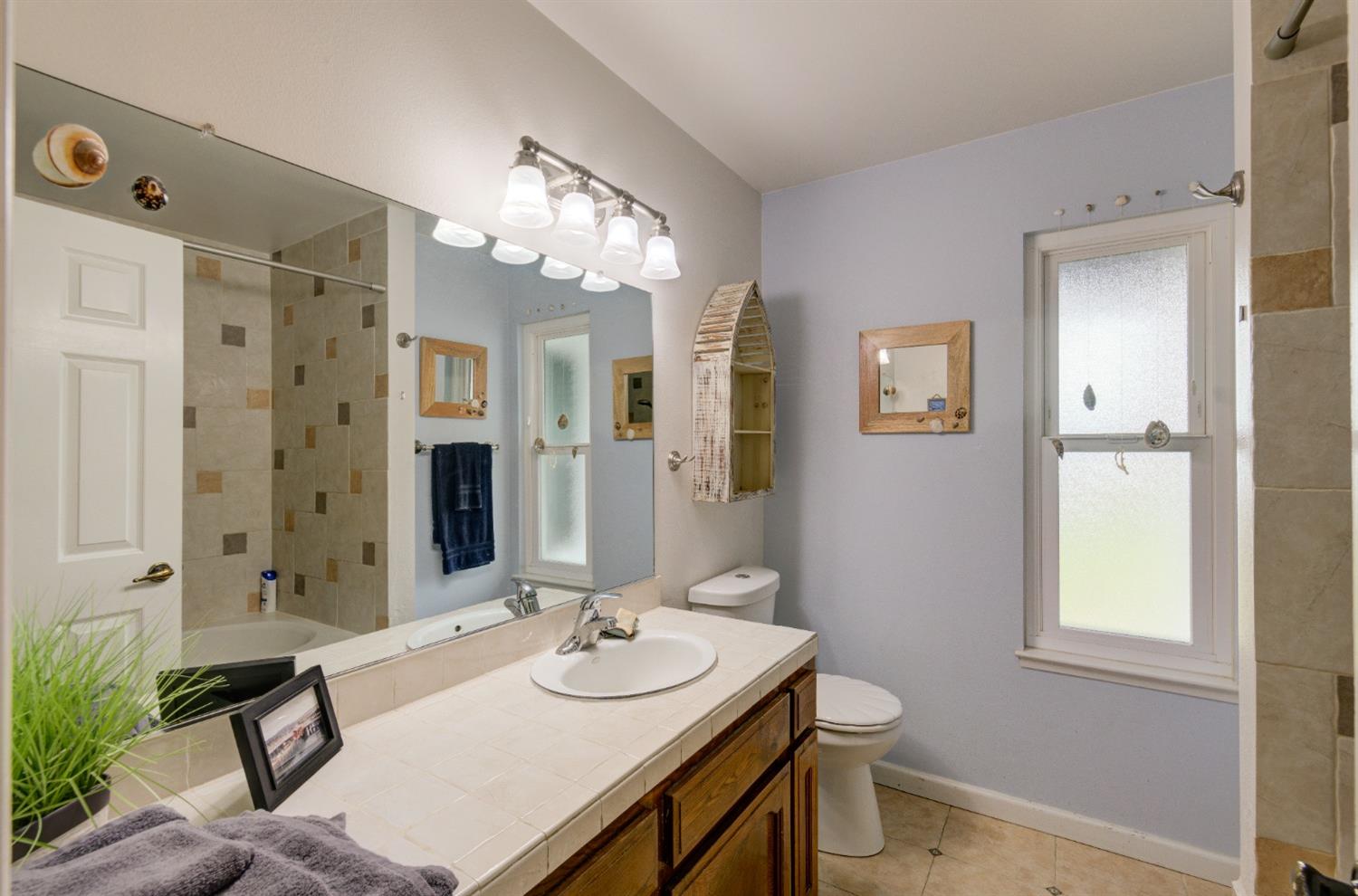 695 West Polson Avenue Clovis, CA 93612 - Photo 19 of 27 a bathroom with a sink double vanity and a mirror