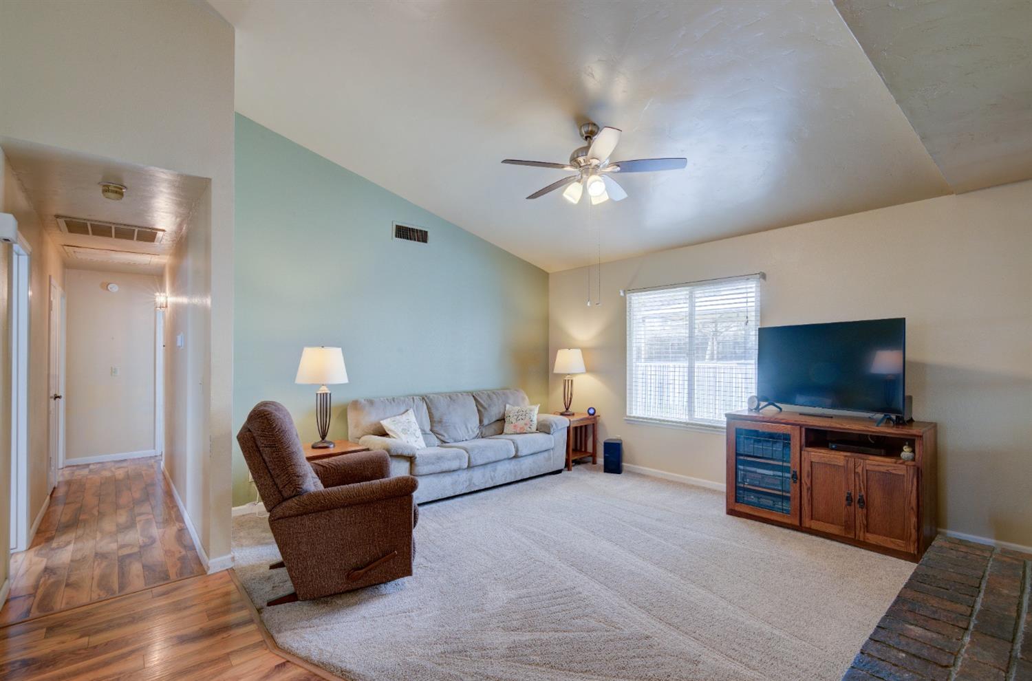 695 West Polson Avenue Clovis, CA 93612 - Photo 6 of 27 a living room with furniture and a flat screen tv