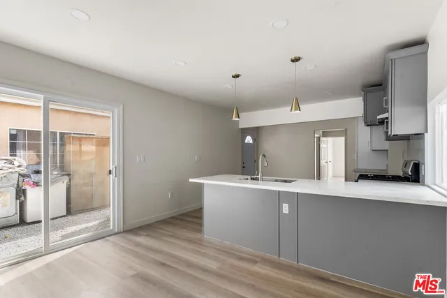 a large kitchen with a large window