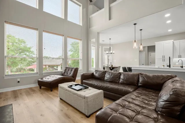 a large kitchen with a table and chairs