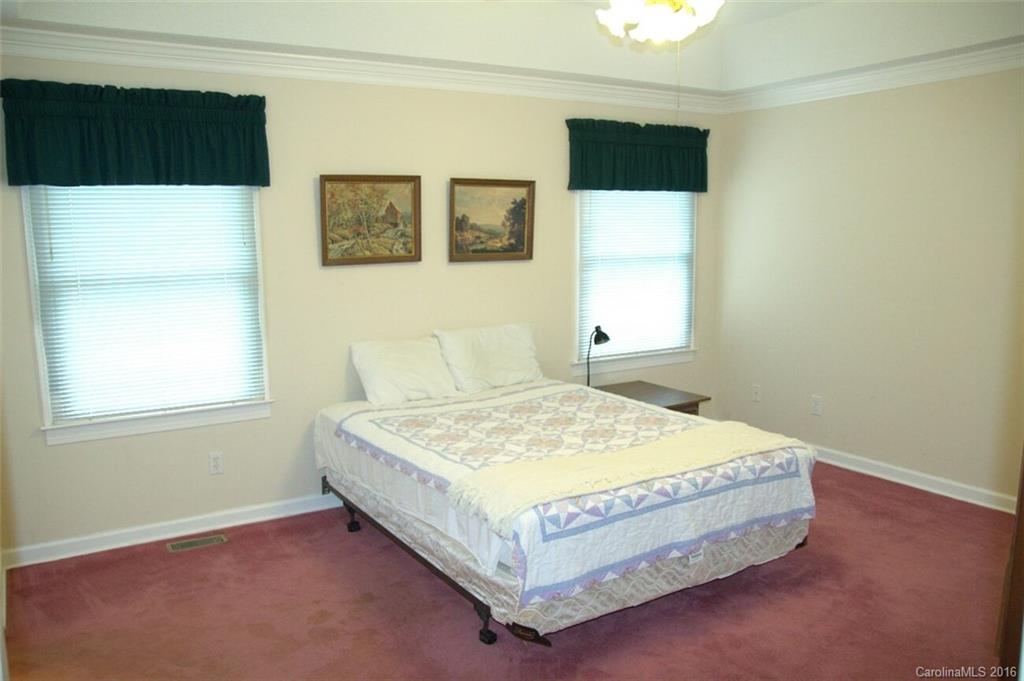 2710 Blue Jay Road Heath Springs, SC 29058 - Photo 13 of 21 a bed sitting in a bedroom next to a window
