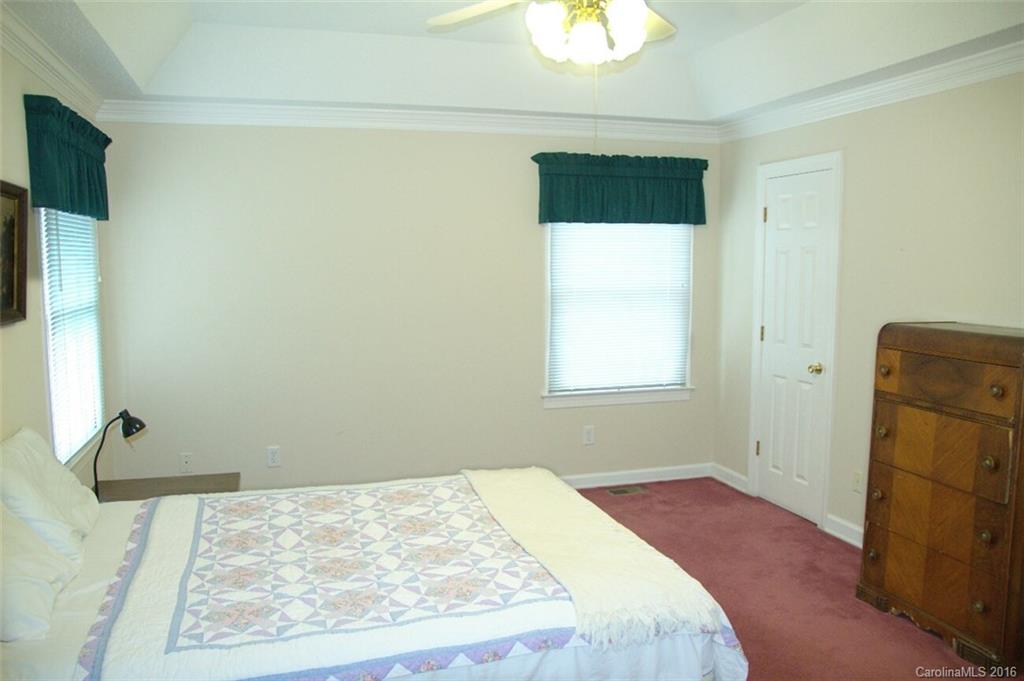 2710 Blue Jay Road Heath Springs, SC 29058 - Photo 15 of 21 a bedroom with a bed and a rug