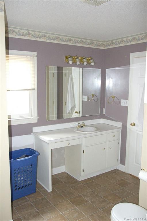 2710 Blue Jay Road Heath Springs, SC 29058 - Photo 17 of 21 a bathroom with a sink and a mirror
