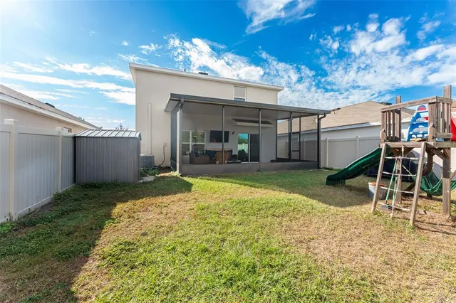 a view of a house with a fence