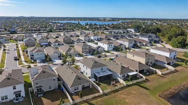 an aerial view of a city with ocean view