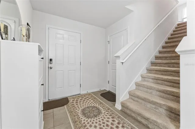 a view of entryway with stairs and wooden floor