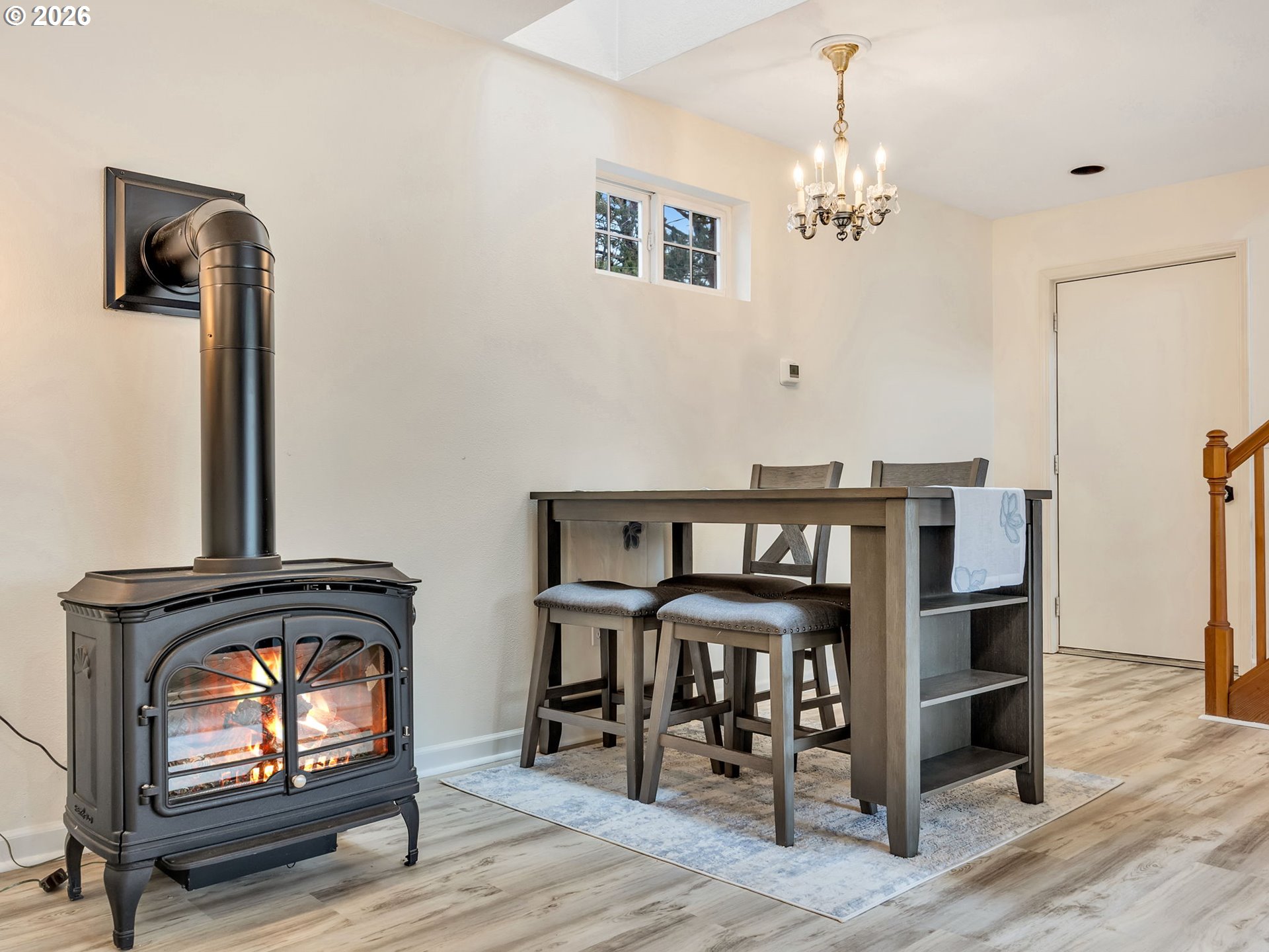 1761 South Edgewood Street Seaside, OR 97138 - Photo 15 of 48 a view of a workspace with furniture and chandelier