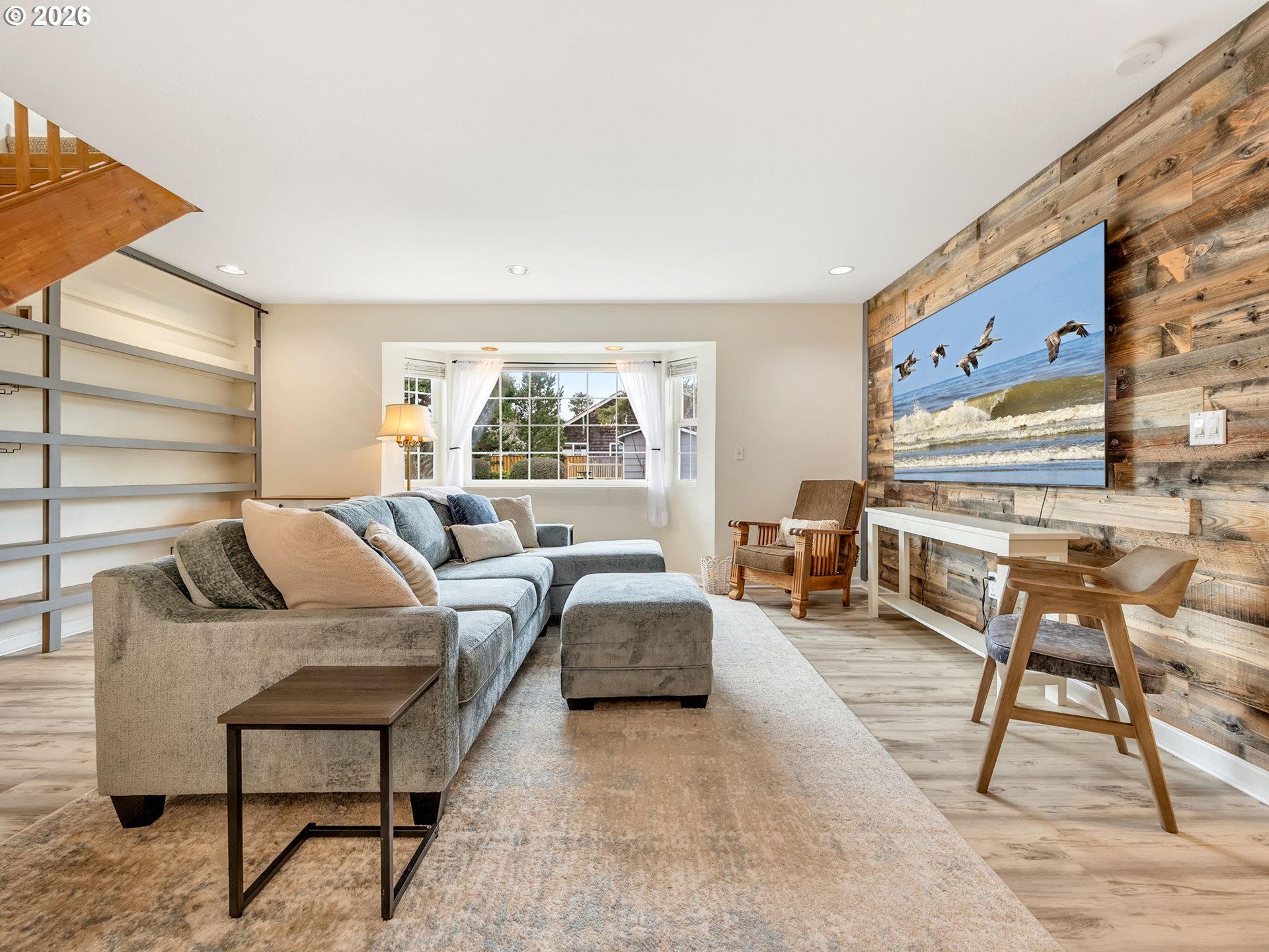 1761 South Edgewood Street Seaside, OR 97138 - Photo 17 of 48 a living room with furniture and a lamp