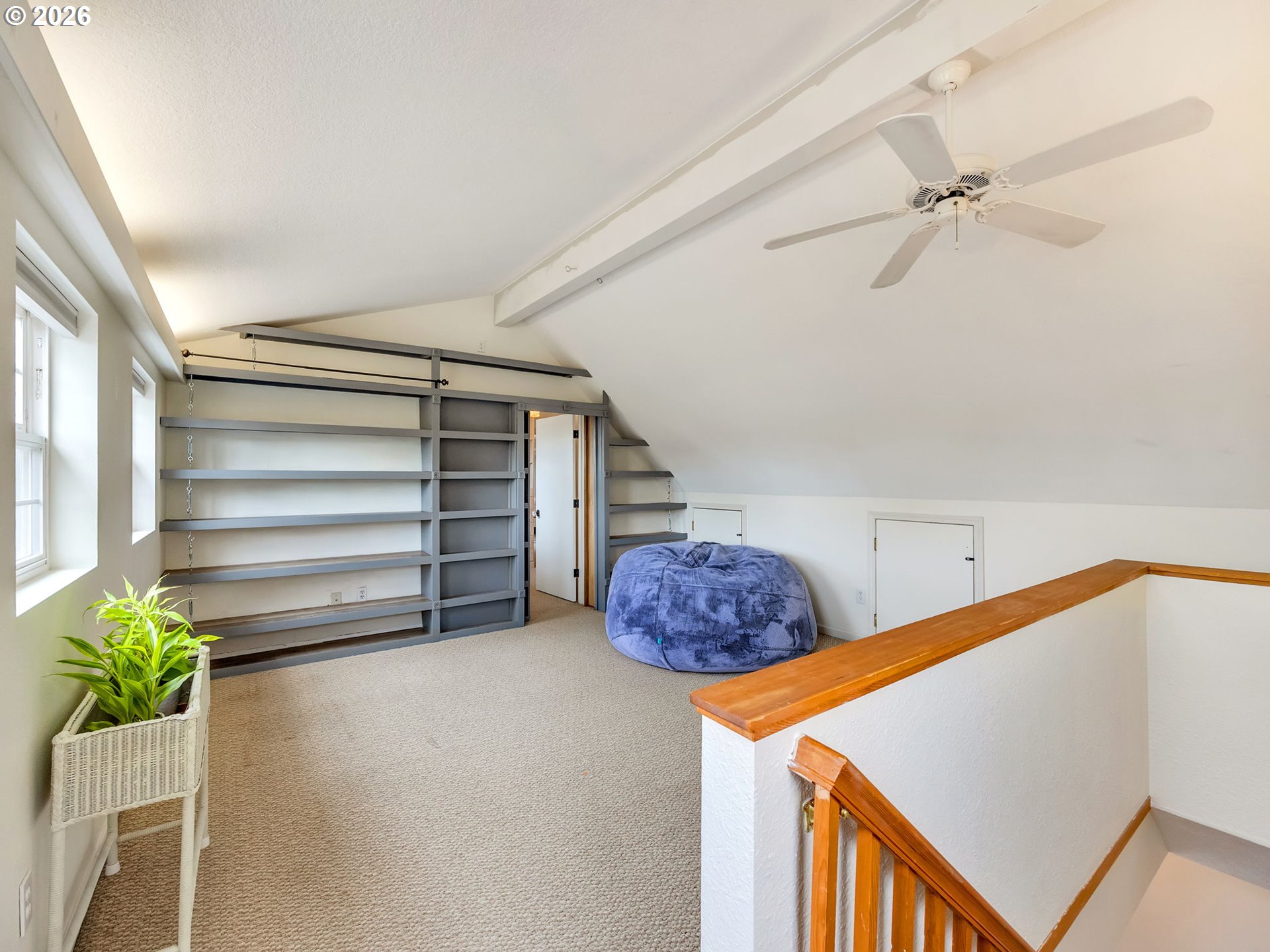 1761 South Edgewood Street Seaside, OR 97138 - Photo 25 of 48 a utility room with a window and a ceiling fan