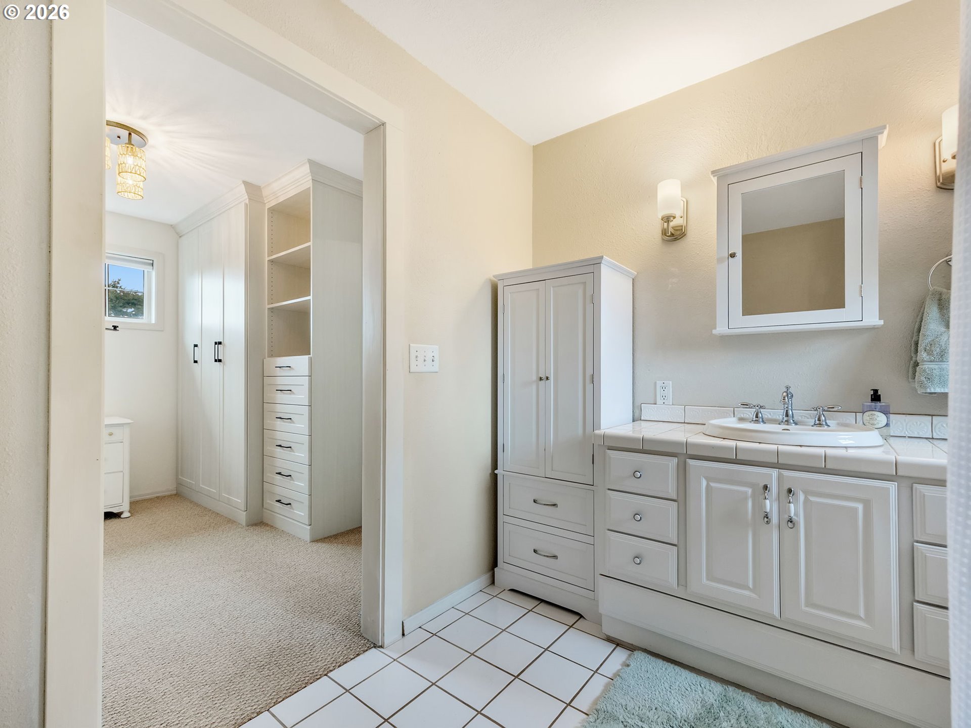 1761 South Edgewood Street Seaside, OR 97138 - Photo 34 of 48 a spacious bathroom with a granite countertop sink mirror and