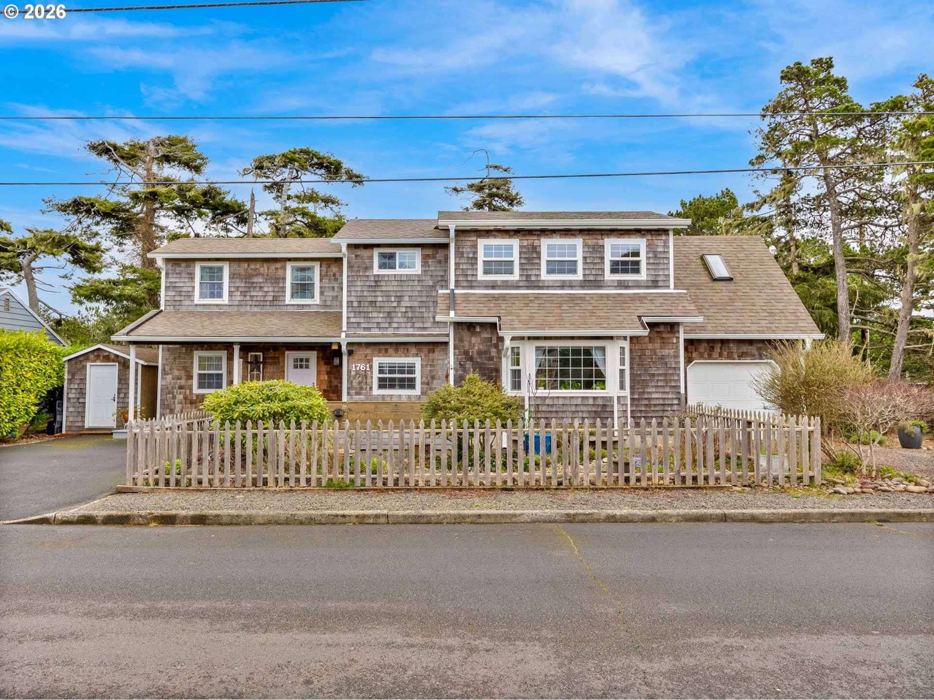 1761 South Edgewood Street Seaside, OR 97138 - Photo 47 of 48 a front view of a house with a garden