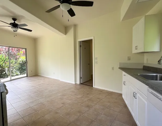 a view of a kitchen with a sink and cabinet