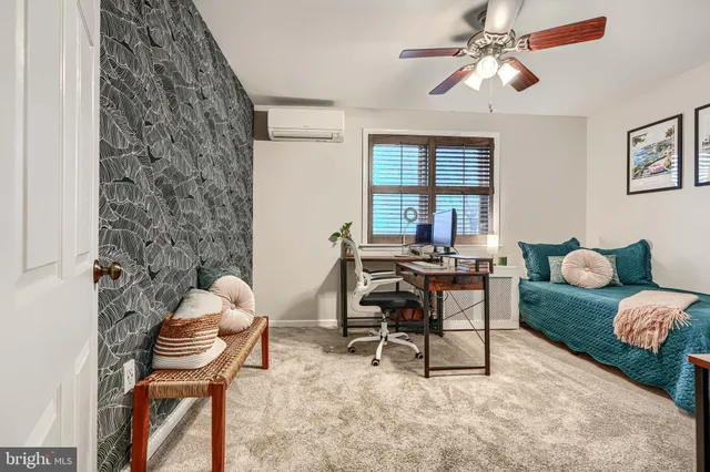 a view of a workspace with furniture