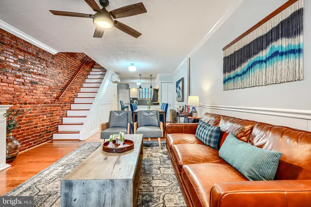 a living room with furniture fireplace and flat screen tv